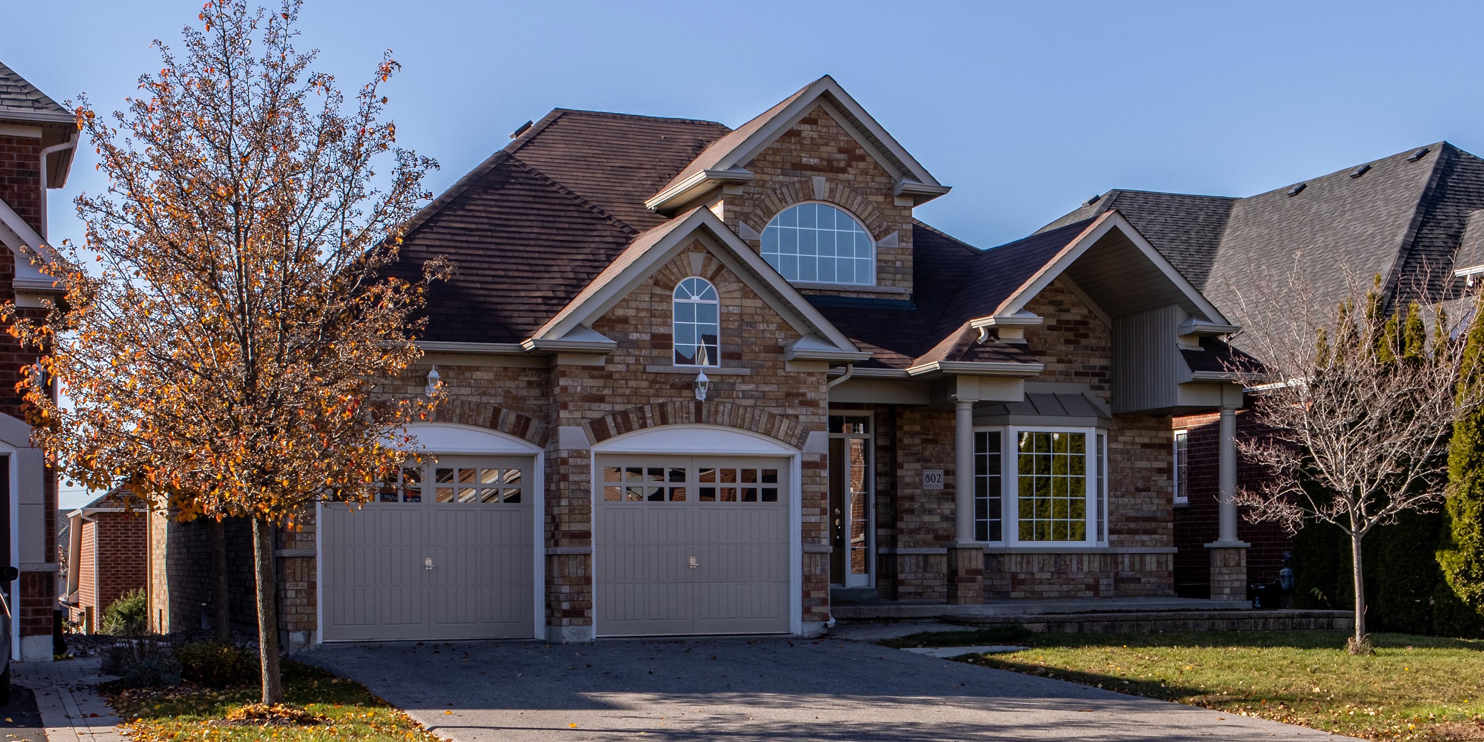 Traditional brick and grey house