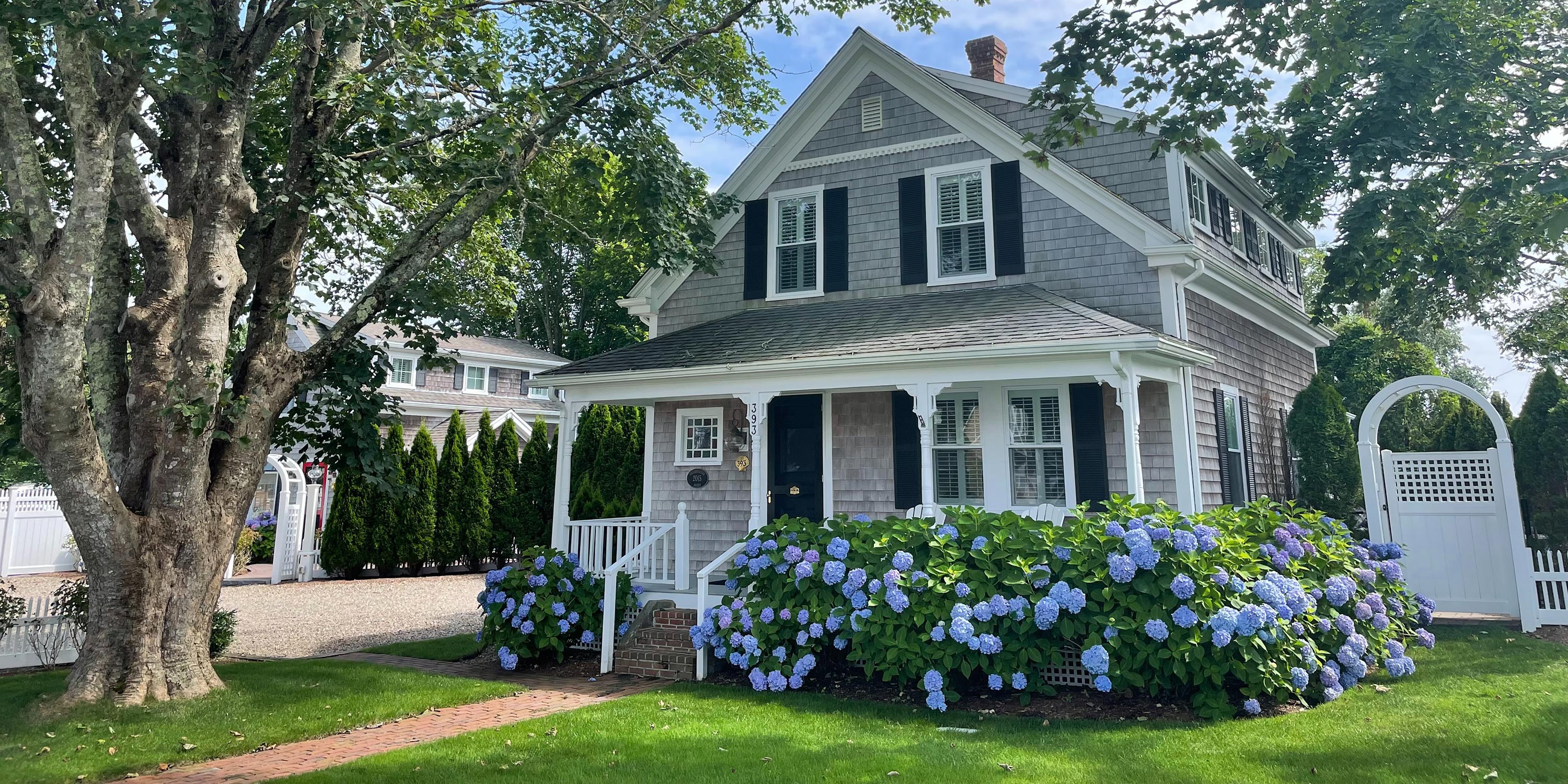Gey house with flowers 